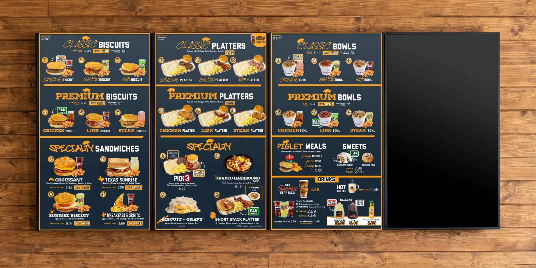 The same four vertical screens on the wood plank wall, switched to the Hog-N-Bones breakfast menu system, with the rotating LTO (limited-time offer) screen
