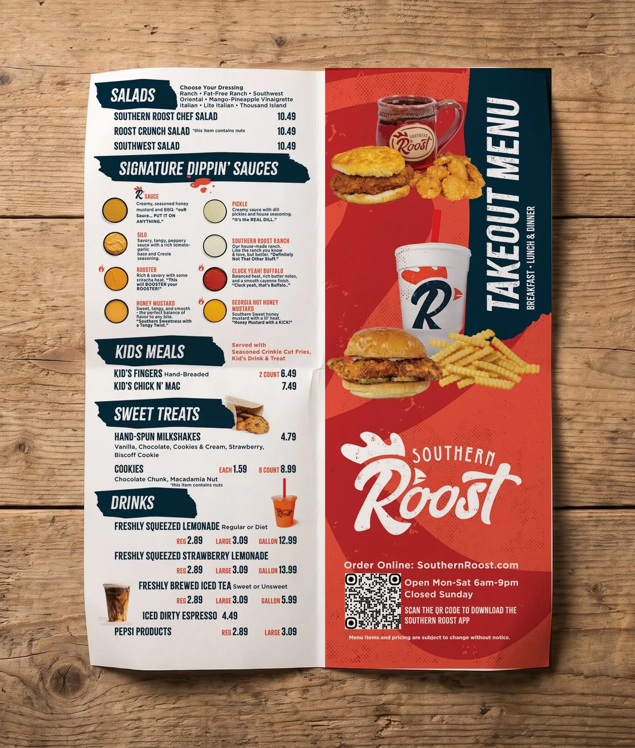 Southern Roost to-go half-fold menu, printed and creased, on a wood table